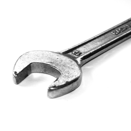 What are the SAE and AISI steel grade classification systems